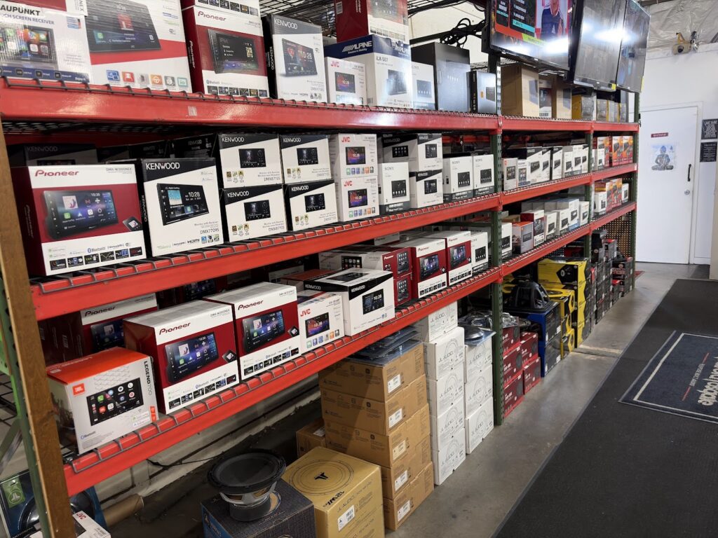 Wall of car stereo head units on display