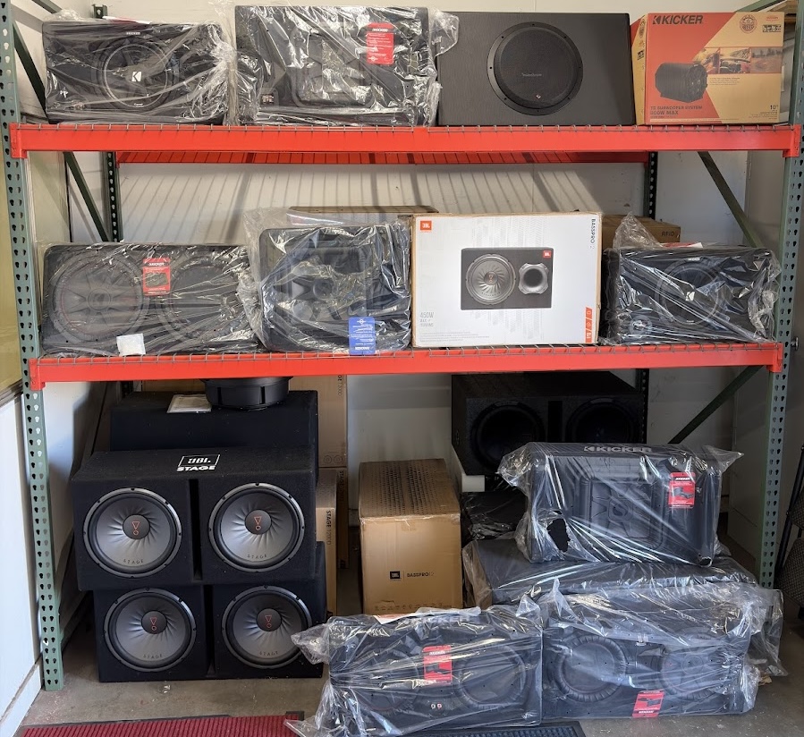 Rack of subwoofers on display